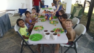 Kids eating breakfast together